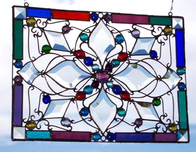 Colorful rectangular border adds highlights to Emergence Glass Mandala