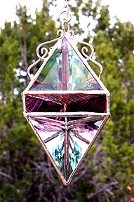 Large beveled pendant shape glows like a jewel.