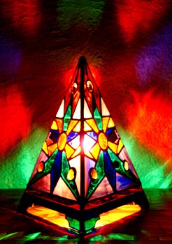 The Anasazi Sun Pyramid Lamp has a Southwestern design and broadcasts in all directions an inspiring light show of luminous colors.