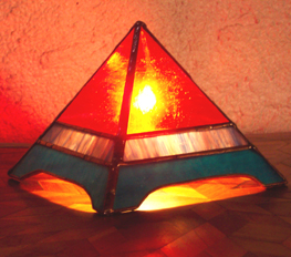 The Fire Glo Pyramid Lamp has a warm radiant glow.